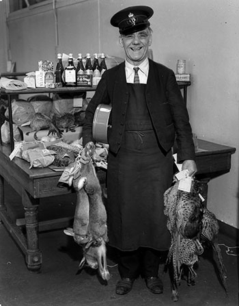 postman with dead rabbits for delivery
